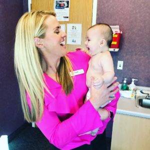 Cami Kessler Holds Pediatric Patient